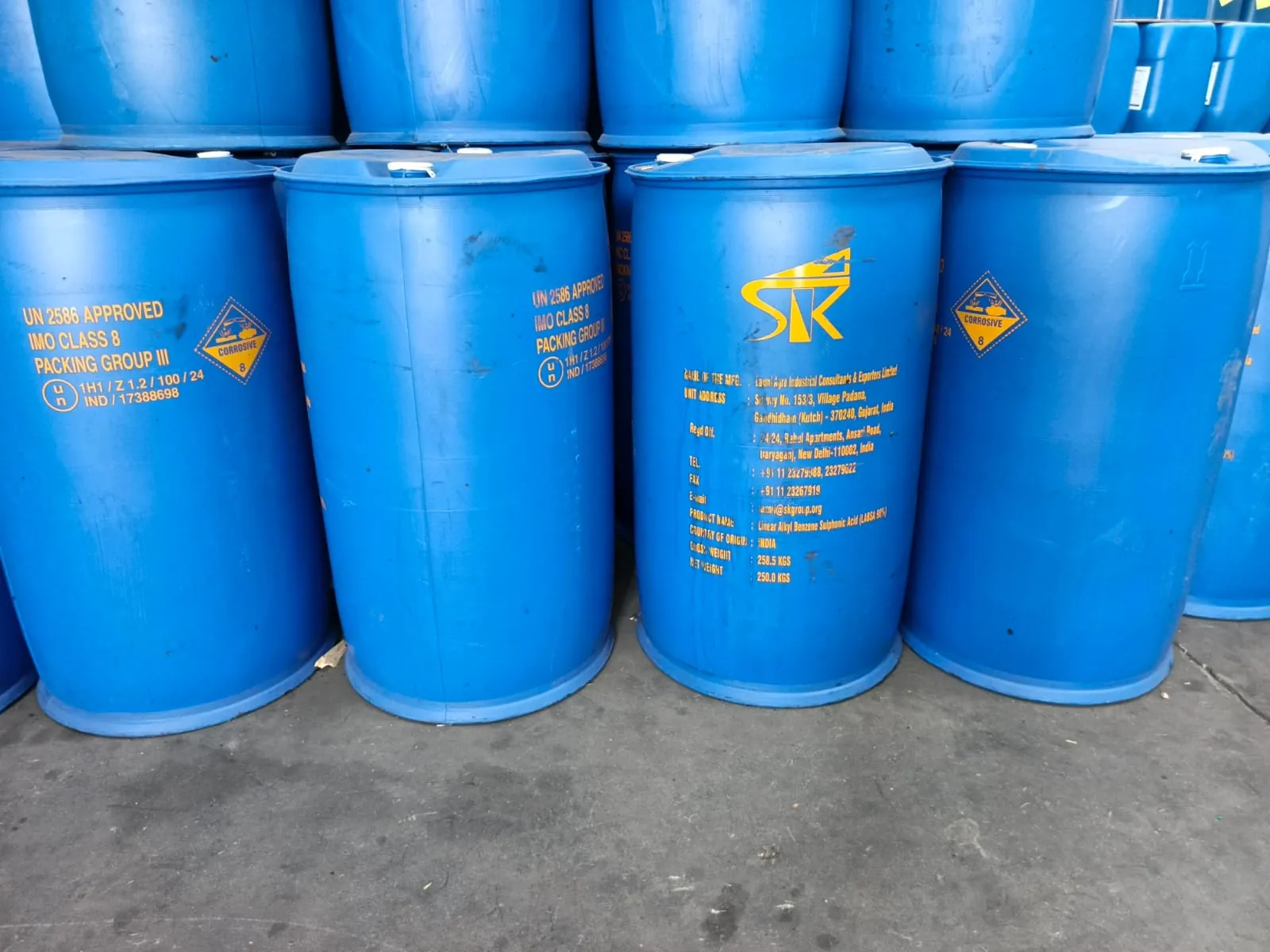Rows of 250 kg drums of LABSA stacked in the Riziki store